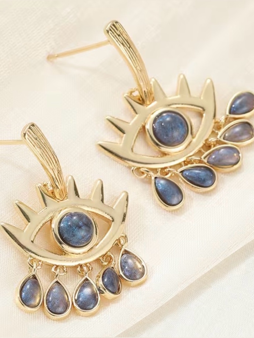 Gold Eye Drop Earrings with Blue Stones